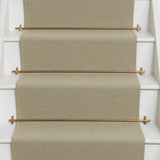 Diamond geometric flatweave runner in sand on white staircase