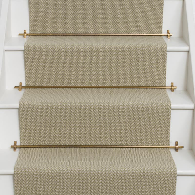 Diamond geometric flatweave runner in sand on white staircase