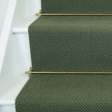 Diamond geometric flatweave runner in green on white staircase