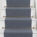 Diamond geometric flatweave runner in blue on white staircase