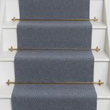 Diamond geometric flatweave runner in blue on white staircase