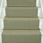 Diamond geometric flatweave runner in green on white staircase