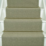 Diamond geometric flatweave runner in green on white staircase