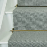 Diamond geometric flatweave runner in slate blue on white staircase