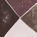 Detail of wallpaper in an abstract geometric print in shades of brown, purple and gray on a white field.