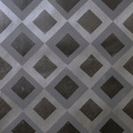 Detail of wallpaper in a diamond lattice print in shades of gray and charcoal.