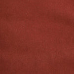 Detail of velvet fabric yardage in rust.