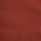 Detail of velvet fabric yardage in rust.