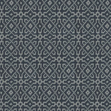 Textured rug with a geometric pattern in turquoise on black