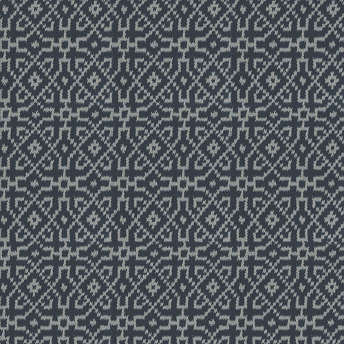 Textured rug with a geometric pattern in turquoise on black