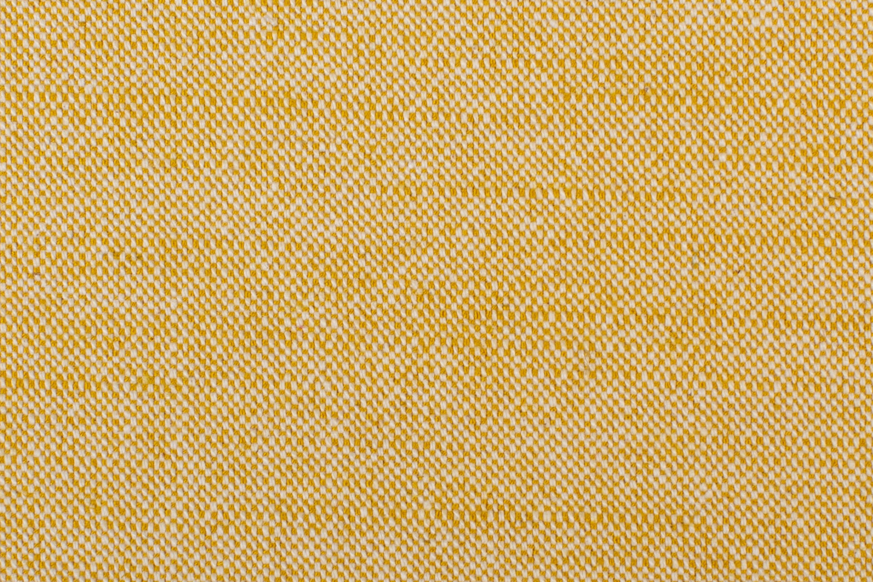 Detail of woven fabric yardage in yellow.