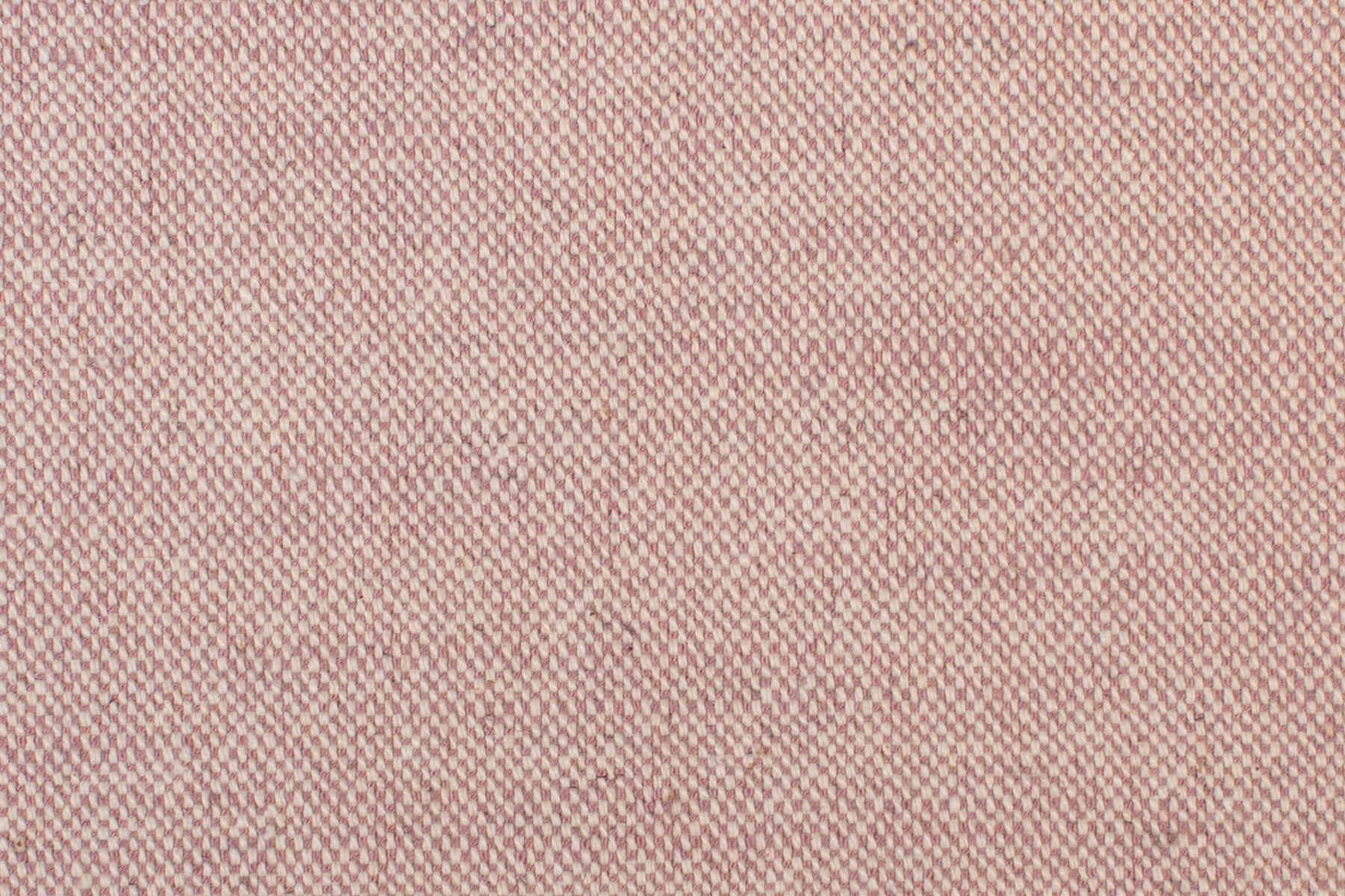 Detail of woven fabric yardage in textured cream and pink.