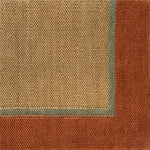 Close up of a flatweave rug in tan with a blue and coral border. 