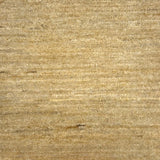 Textured handwoven carpet in beige.