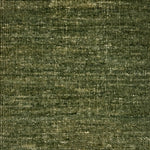 Textured handwoven carpet in green. 