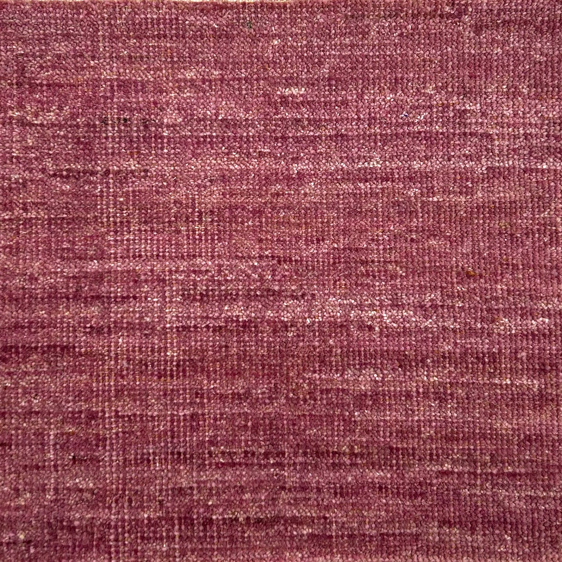 Textured handwoven carpet in purple