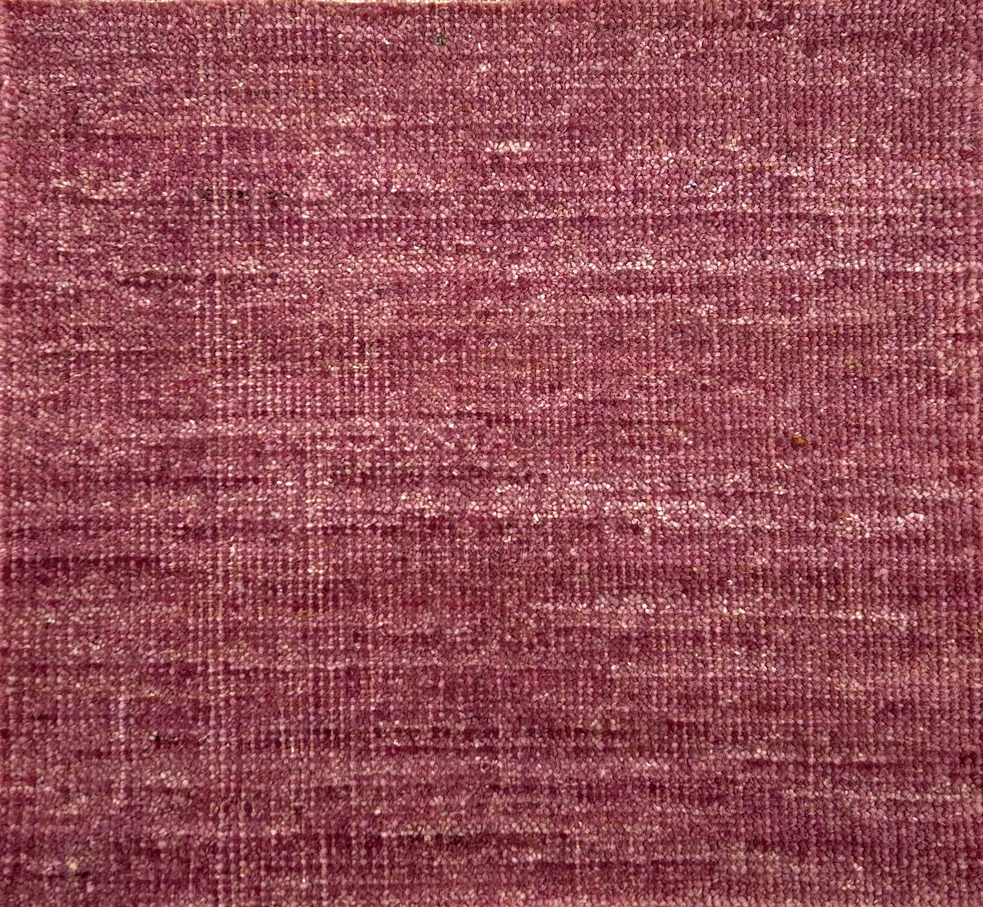 Textured handwoven carpet in purple