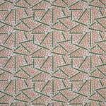 Printed fabric detail in a playful dot and line pattern in coral pink and green