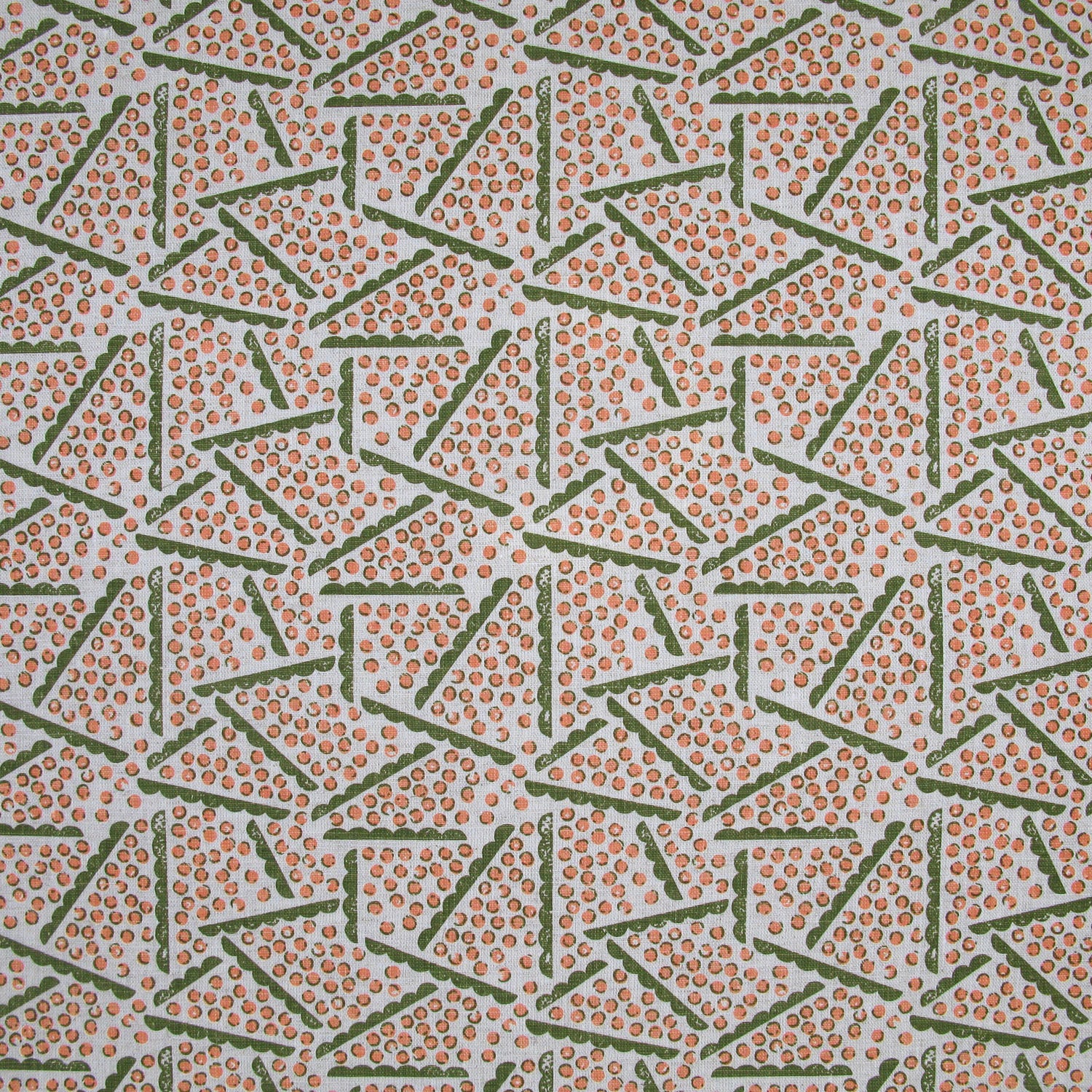 Printed fabric detail in a playful dot and line pattern in coral pink and green