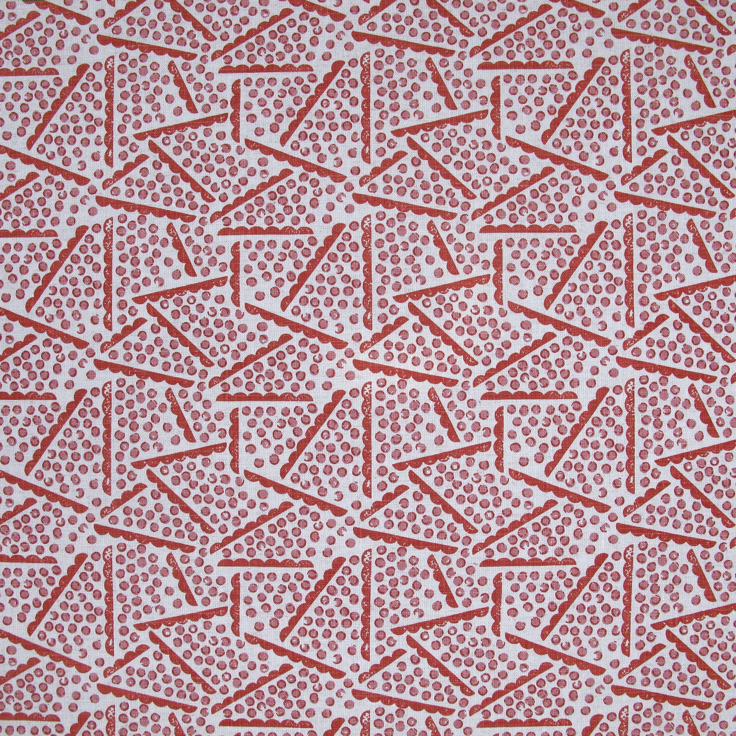 Printed fabric detail in a playful dot and line pattern in pink and cherry red