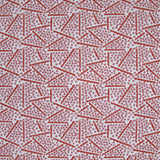 Printed fabric detail in a playful dot and line pattern in pink and cherry red