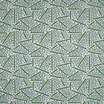 Printed fabric detail in a playful dot and line pattern in  acqua and grass green