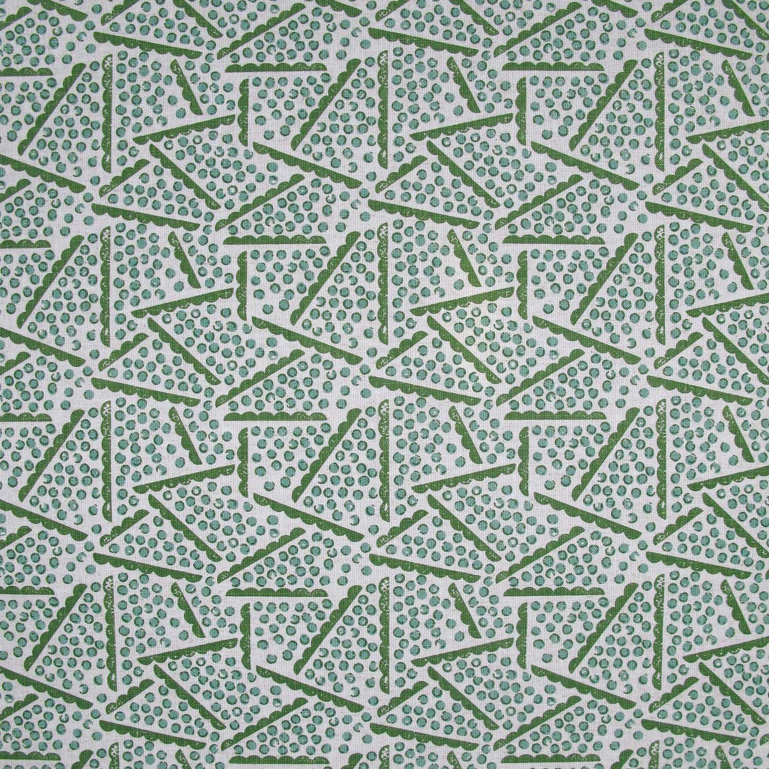 Printed fabric detail in a playful dot and line pattern in  acqua and grass green