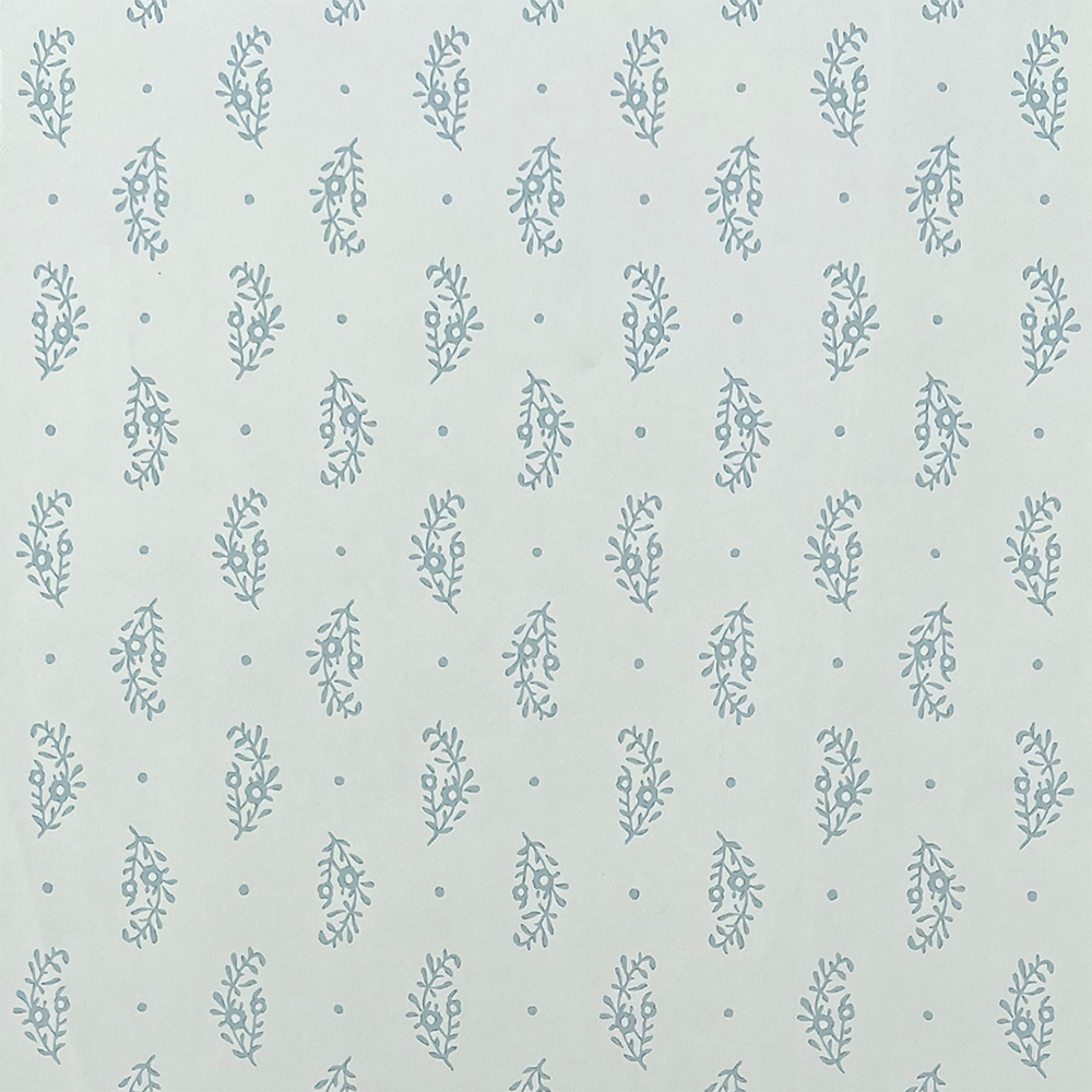 Detail of wallpaper in a floral paisley print in blue-gray on a light blue field.