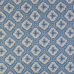 Detail of fabric in a playful floral grid print in shades of blue on a white field.