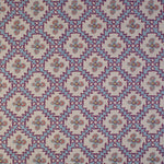 Detail of fabric in a playful floral grid print in blue, pink and purple on a white field.