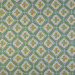 Detail of fabric in a playful floral grid print in green, yellow and blue on a white field.