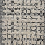 Handknotted rug sample in a textural geometric pattern in grey and ivory.