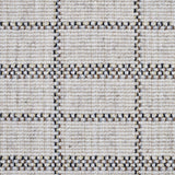 Broadloom carpet detail in plaid grid in shades of blue and brown on a beige field.