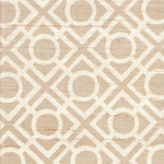 Detail of fabric in a geometric lattice print in tan on a cream field.