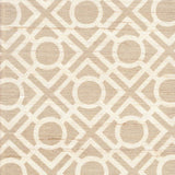 Detail of fabric in a geometric lattice print in tan on a cream field.