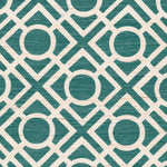 Detail of fabric in a geometric lattice print in turquoise on a cream field.