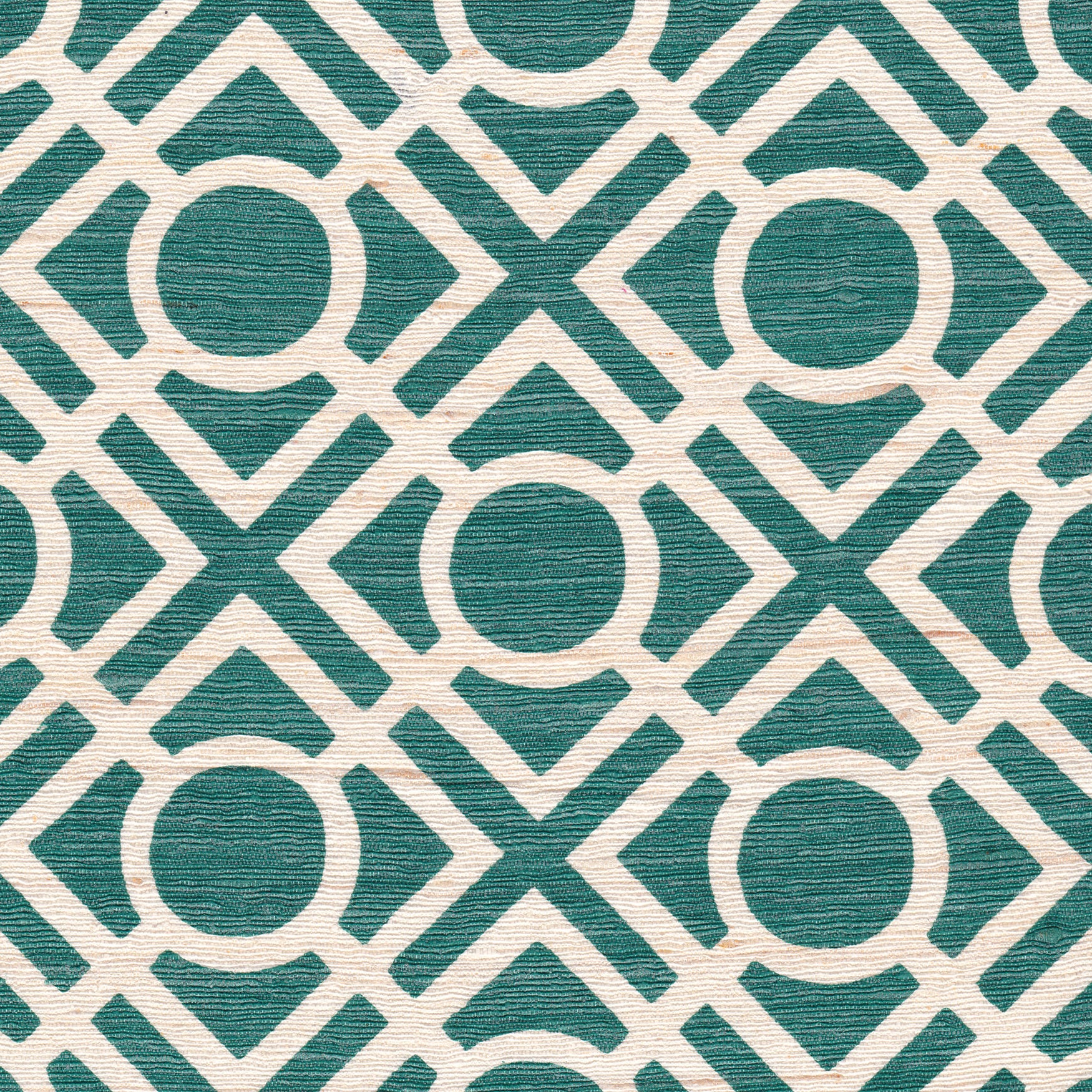 Detail of fabric in a geometric lattice print in turquoise on a cream field.