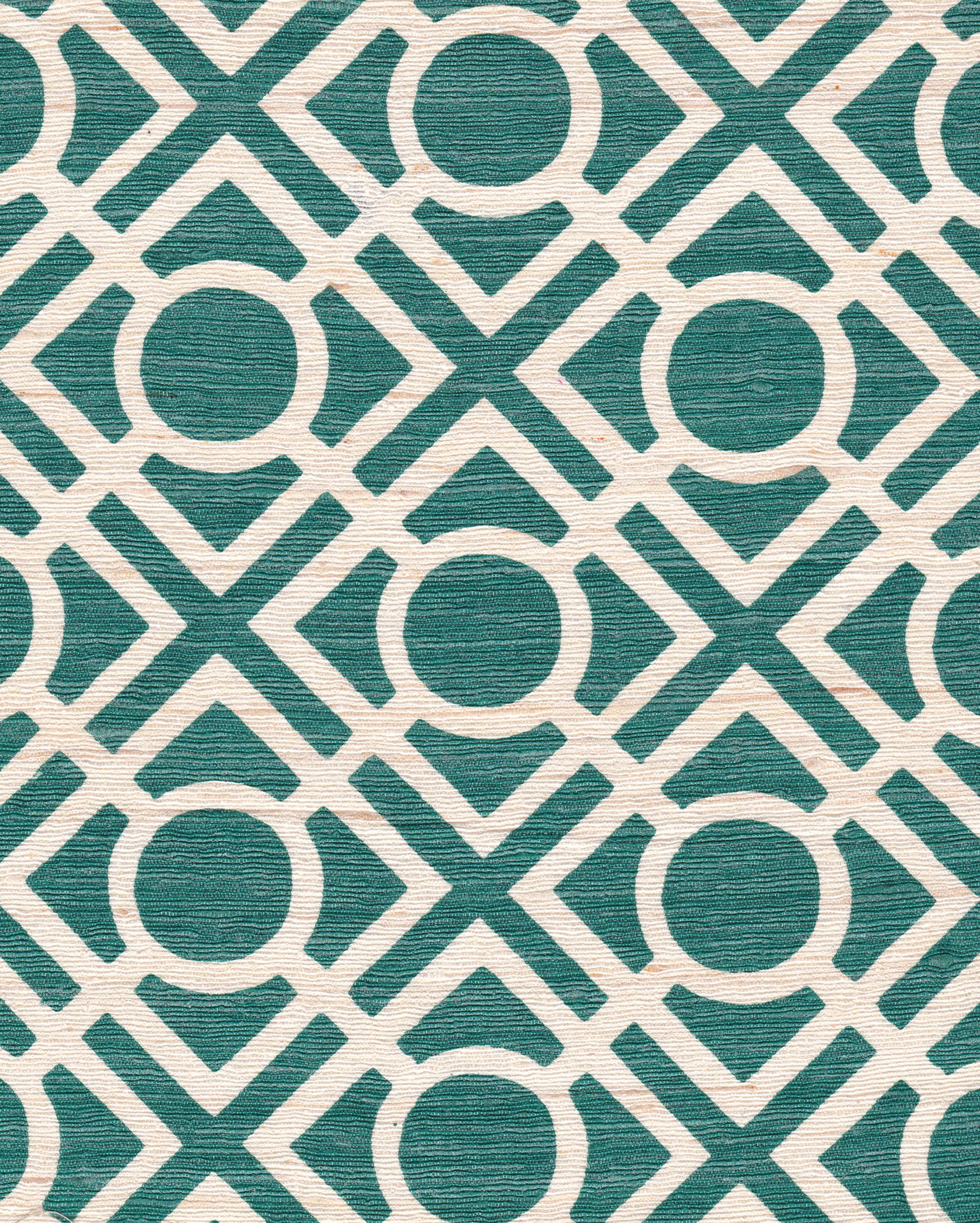 Detail of fabric in a geometric lattice print in turquoise on a cream field.