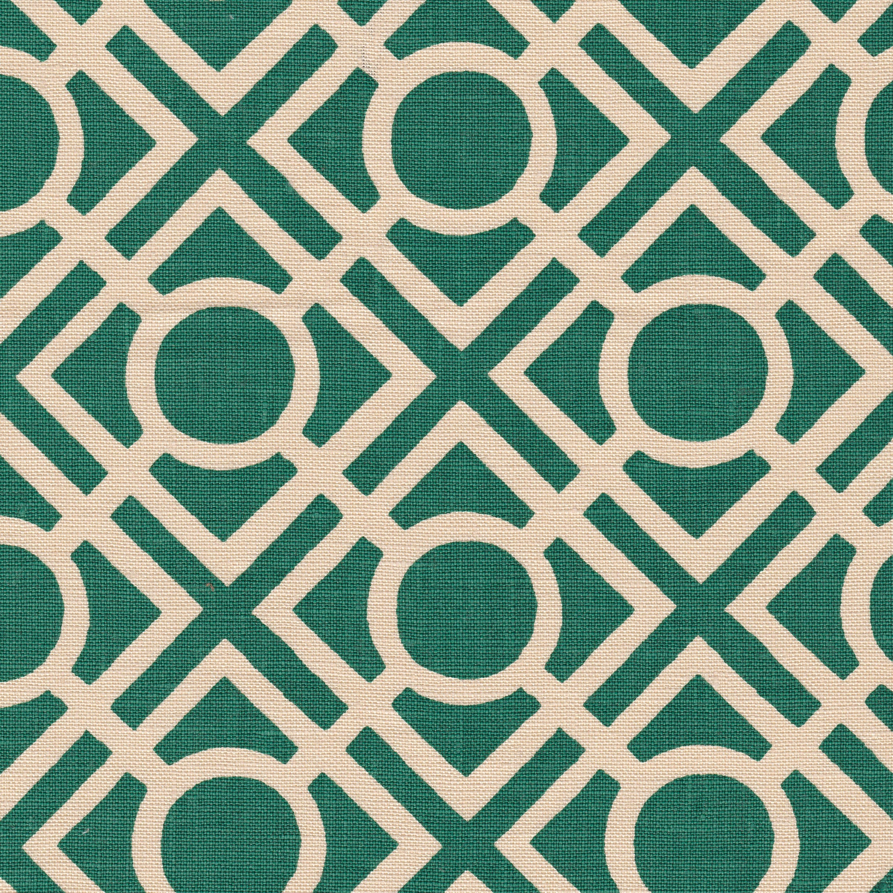 Detail of fabric in a geometric lattice print in turquoise on a cream field.