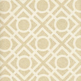 Detail of wallpaper in a geometric lattice print in tan on a cream field.