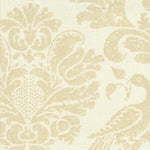 Detail of fabric in a botanical and bird print in tan on a cream field.