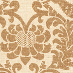 Detail of fabric in a botanical and bird print in brown on a cream field.