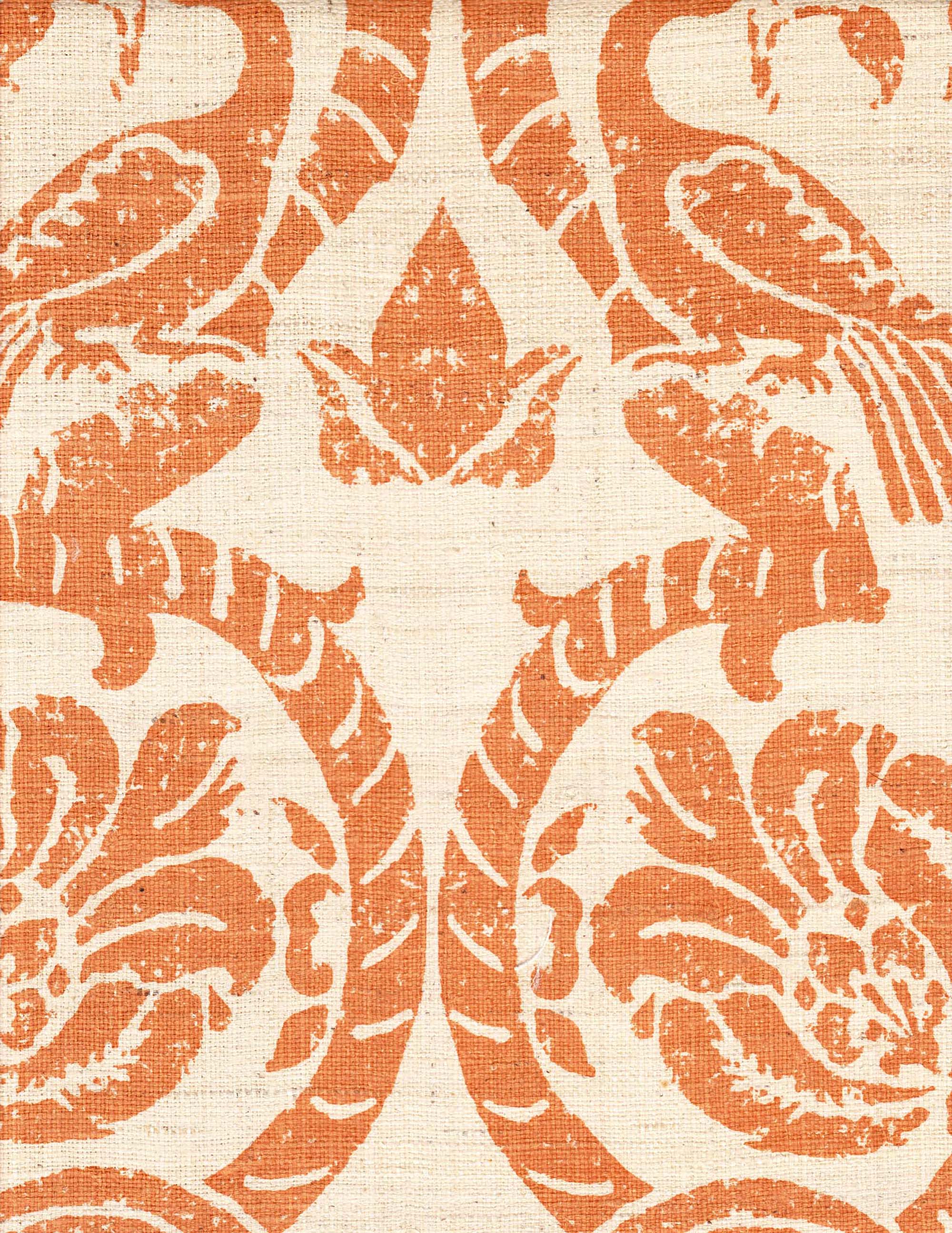 Detail of fabric in a botanical and bird print in orange on a cream field.