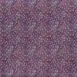 printed linen fabric in a peacock feather pattern in pink and blue on a maroon field.