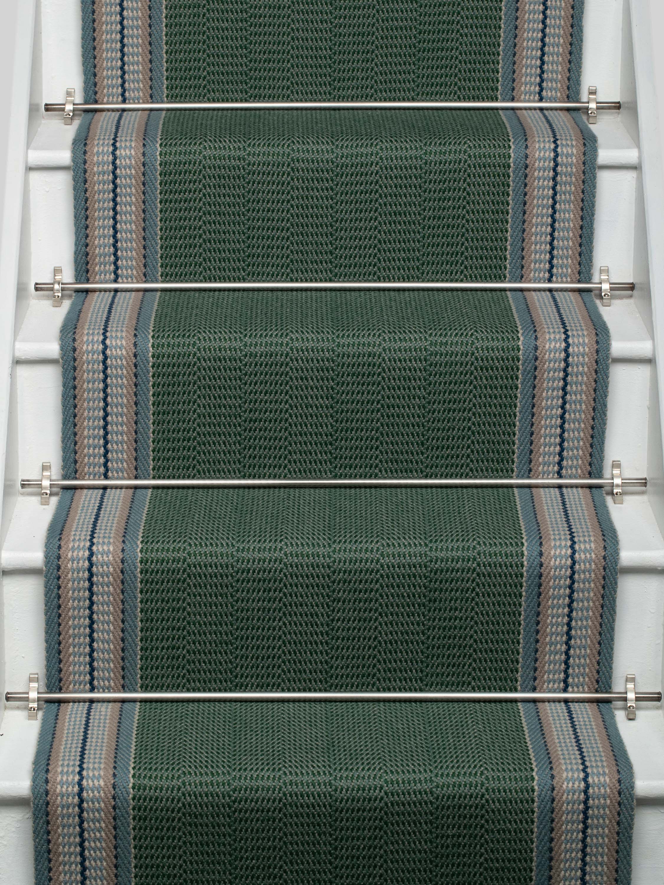 Striped flatweave runner in green and grey on white staircase