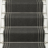 Striped flatweave runner in grey and black on white staircase