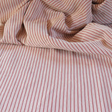 Draped close-up of pink and white striped fabric