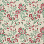 Printed fabric detail in a scrolling botanical print in green, red and pink.