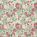 Printed fabric detail in a scrolling botanical print in green, red and pink.