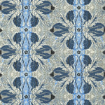 Detail of wallpaper in a textural botanical print in shades of navy, blue and cream on a tan field.